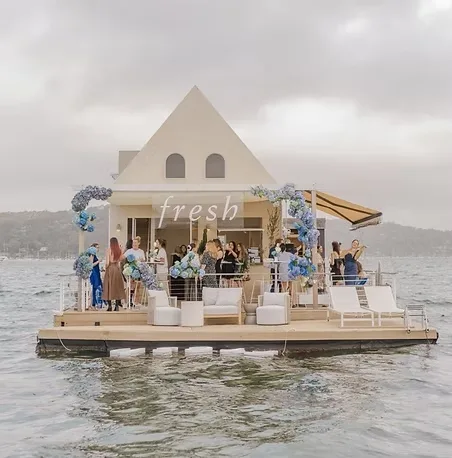 Guests at a floating brand event on Sydney water